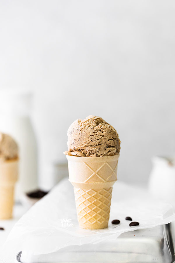 a scoop of No Churn Coffee Ice Cream in an ice cream cone