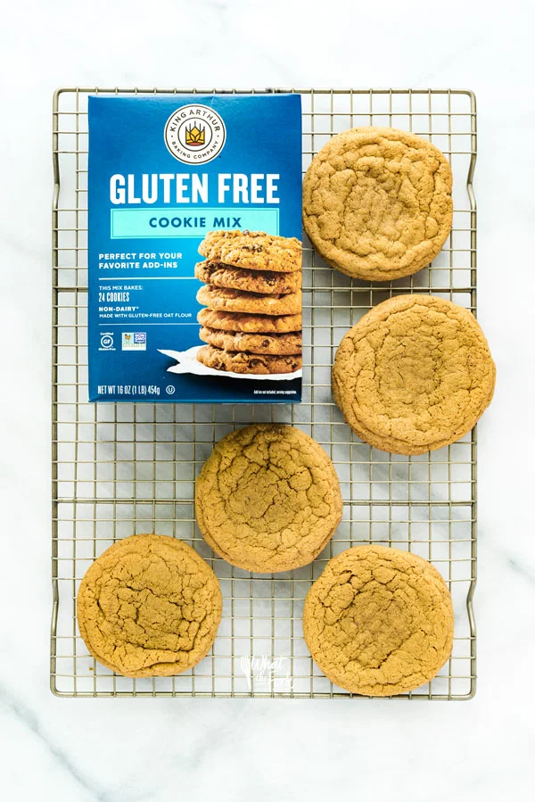 overhead shot of Gluten Free Brown Sugar Cookies on a wire rack with a box of King Arthur Gluten Free Cookie Mix