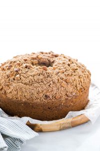baked Gluten Free Sour Cream Coffee Cake Recipe ready to serve on a wax paper lined wood platter