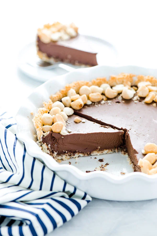 a Macadamia Nut Chocolate Pie with Coconut Crust that has been sliced into