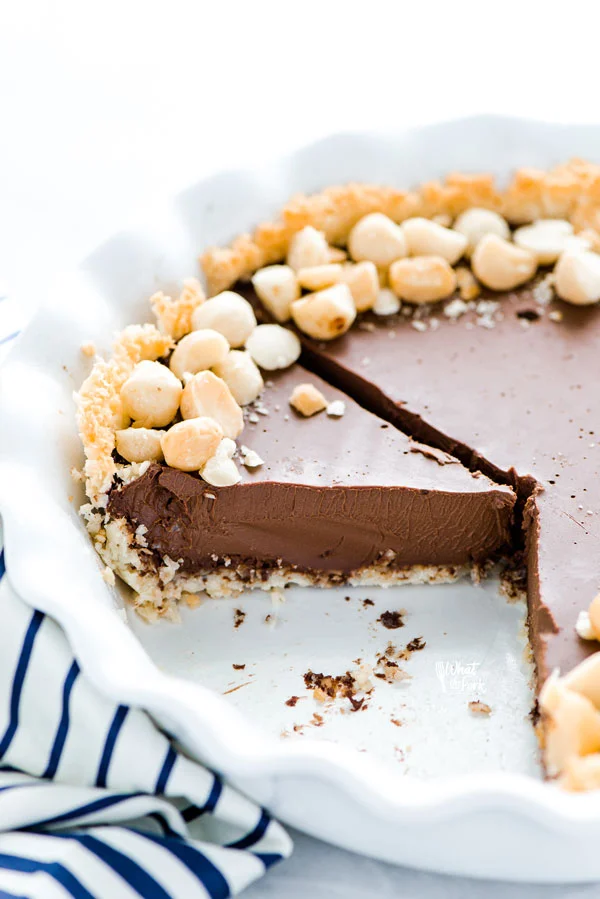 a Macadamia Nut Chocolate Pie with Coconut Crust that's been sliced into