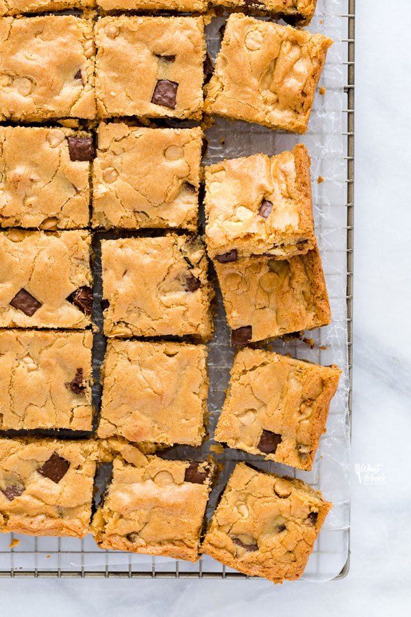 overhead shot of gluten free blondies on a wax paper lined cooling rack