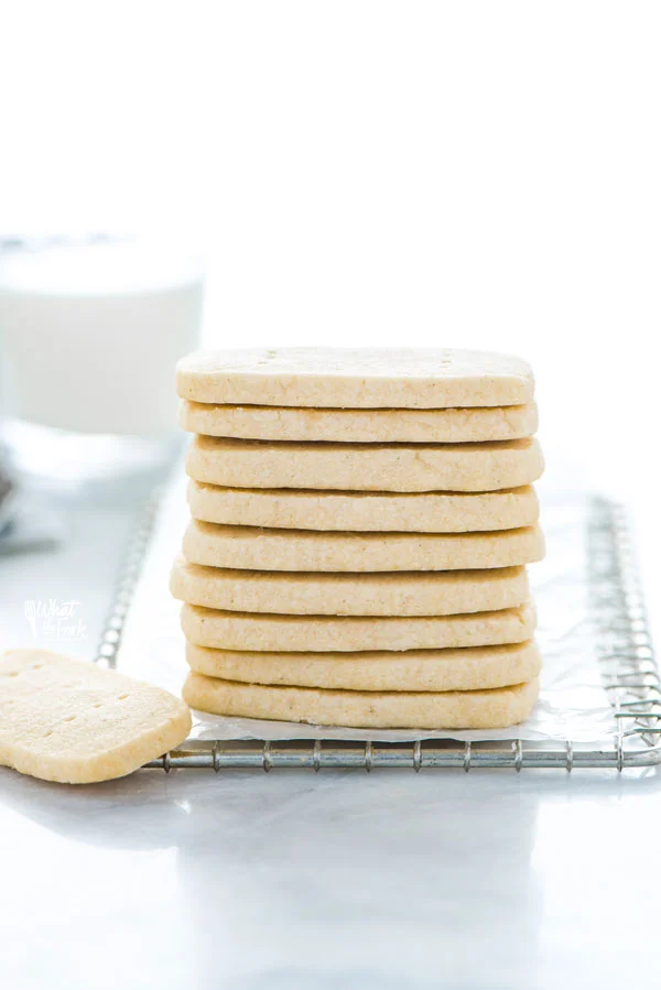 a stack of Gluten Free Shortbread Cookies on a small metal wire rack lined with wax paper