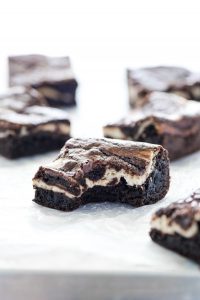 Gluten Free Cheesecake Brownies with a bite taken out