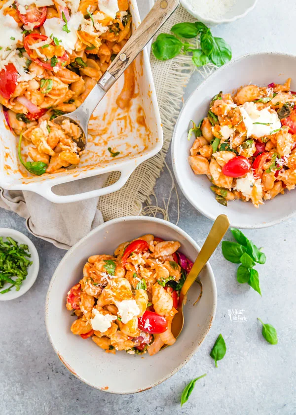 Caprese Pasta Bake Recipe with White Beans in white bowls with gold spoons ready to serve