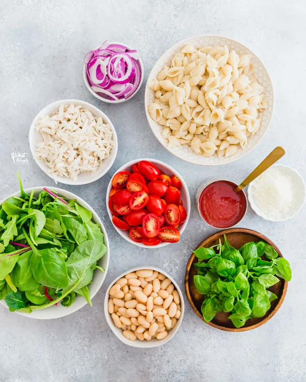 overhead shot of individual ingredients in bowls for Caprese Pasta Bake Recipe with White Beans