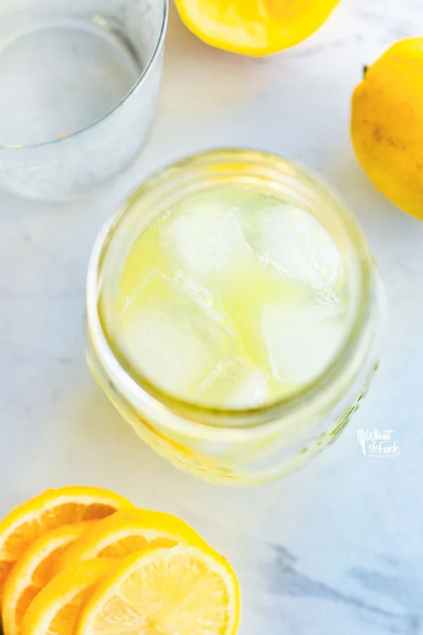 Non-Alcoholic Rosemary Citrus Spritzers being made in a mason jar