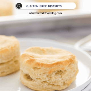 an image of a flaky gluten free biscuit on a white plate with a search bar with the words gluten free biscuits written