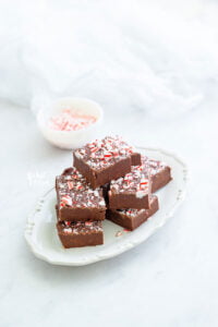 sliced peppermint fudge on a small white oval plate