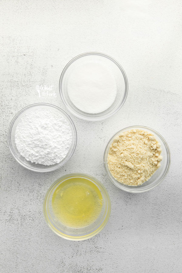 overhead shot of ingredients in individual bowls to make French Macarons