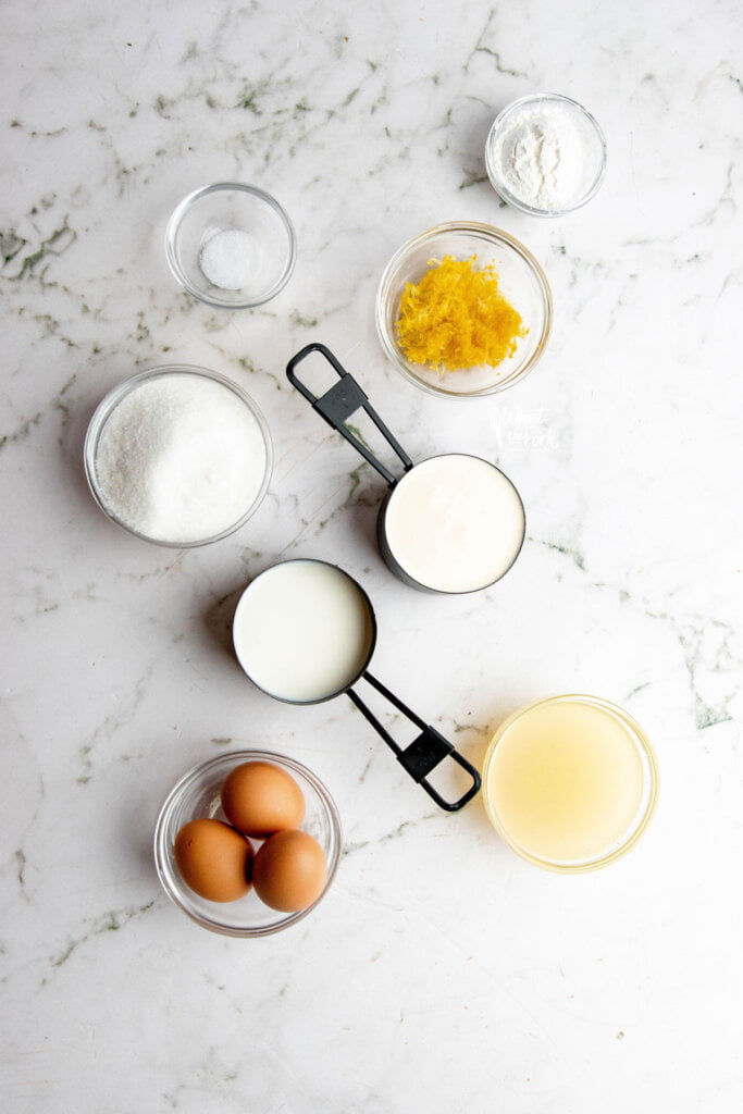 ingredients in individual bowls and measuring cups to make a homemade lemon pudding recipe