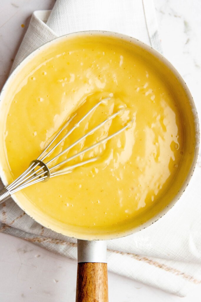 Lemon Pudding being cooked and whisked until it thickens