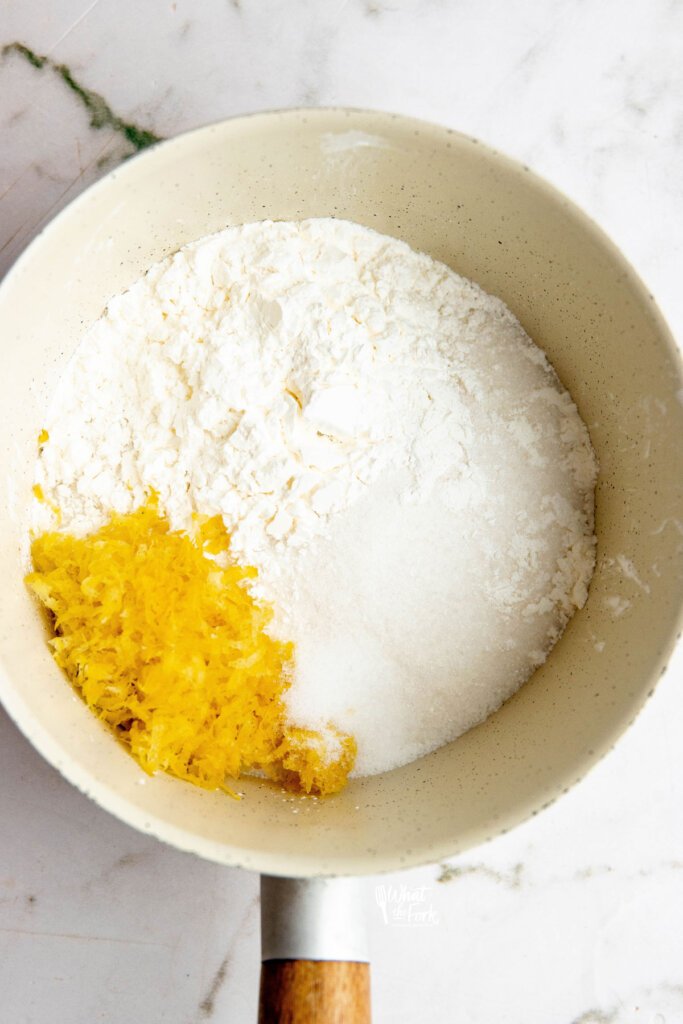 lemon zest, cornstarch, and granulated sugar in a white saucepan to make an Easy Lemon Pudding Recipe