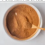 Homemade Pumpkin Pie Spice (Easy DIY Recipe) in a white bowl with text for Pinterest