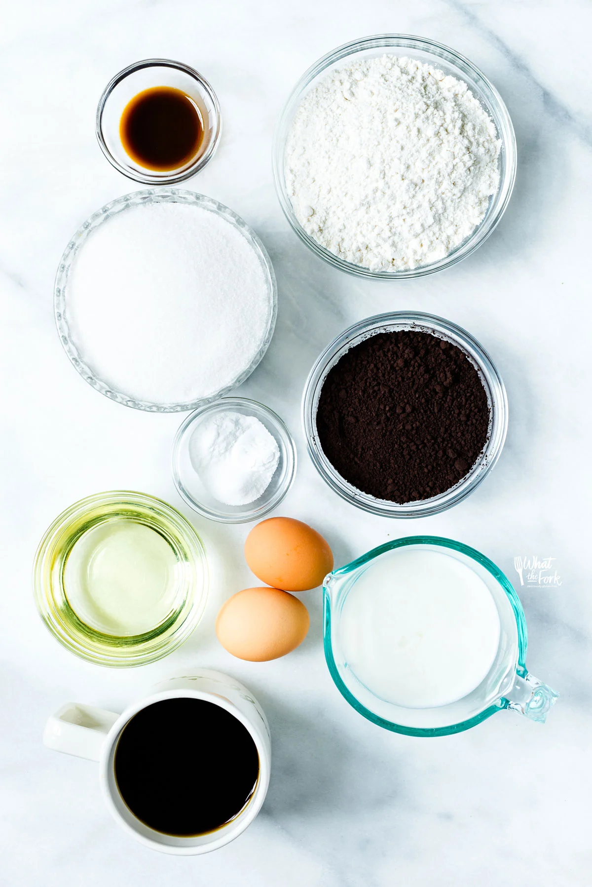 overhead shot of ingredients in individual bowls to make a gluten free black velvet cake recipe