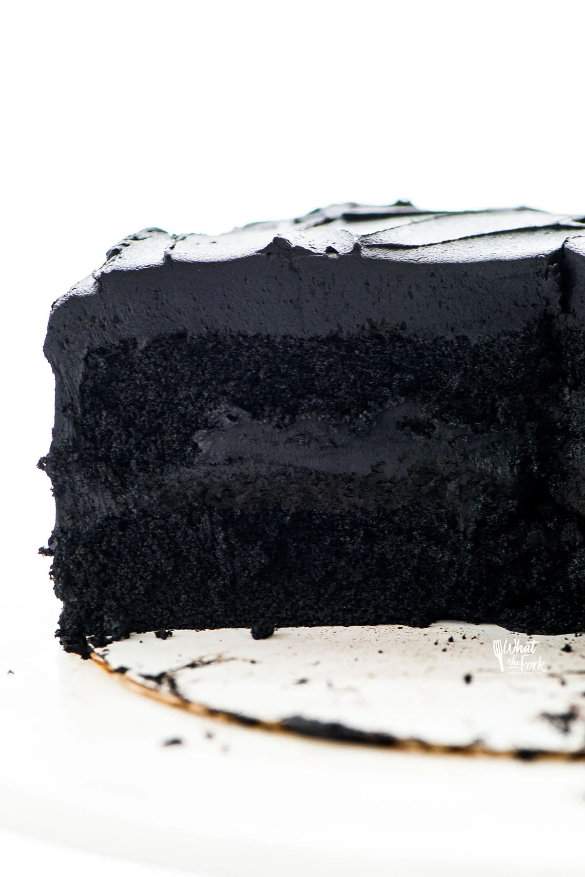 a gluten free black velvet cake that has been sliced into 