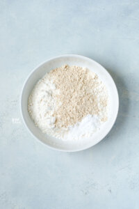 dry ingredients in a small white porcelain bowl for sugar cookies
