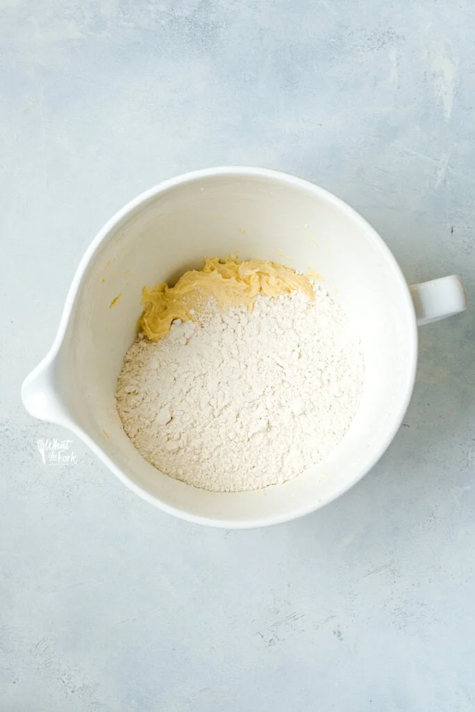 Dry ingredients on top of the creamed butter and sugar in a white stand mixer bowl