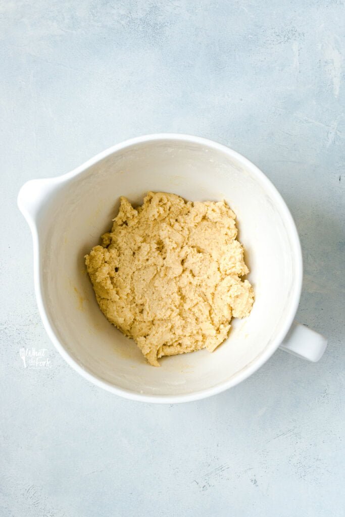 gluten free sugar cookie dough in a white stand mixer bowl
