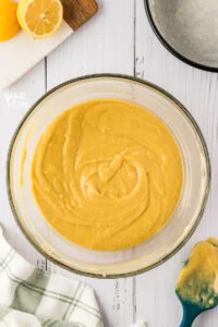 gluten free lemon cake batter in a large clear glass bowl