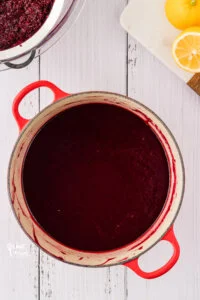 overhead shot of a blended blackberry cake filling ready to be cooked to thicken