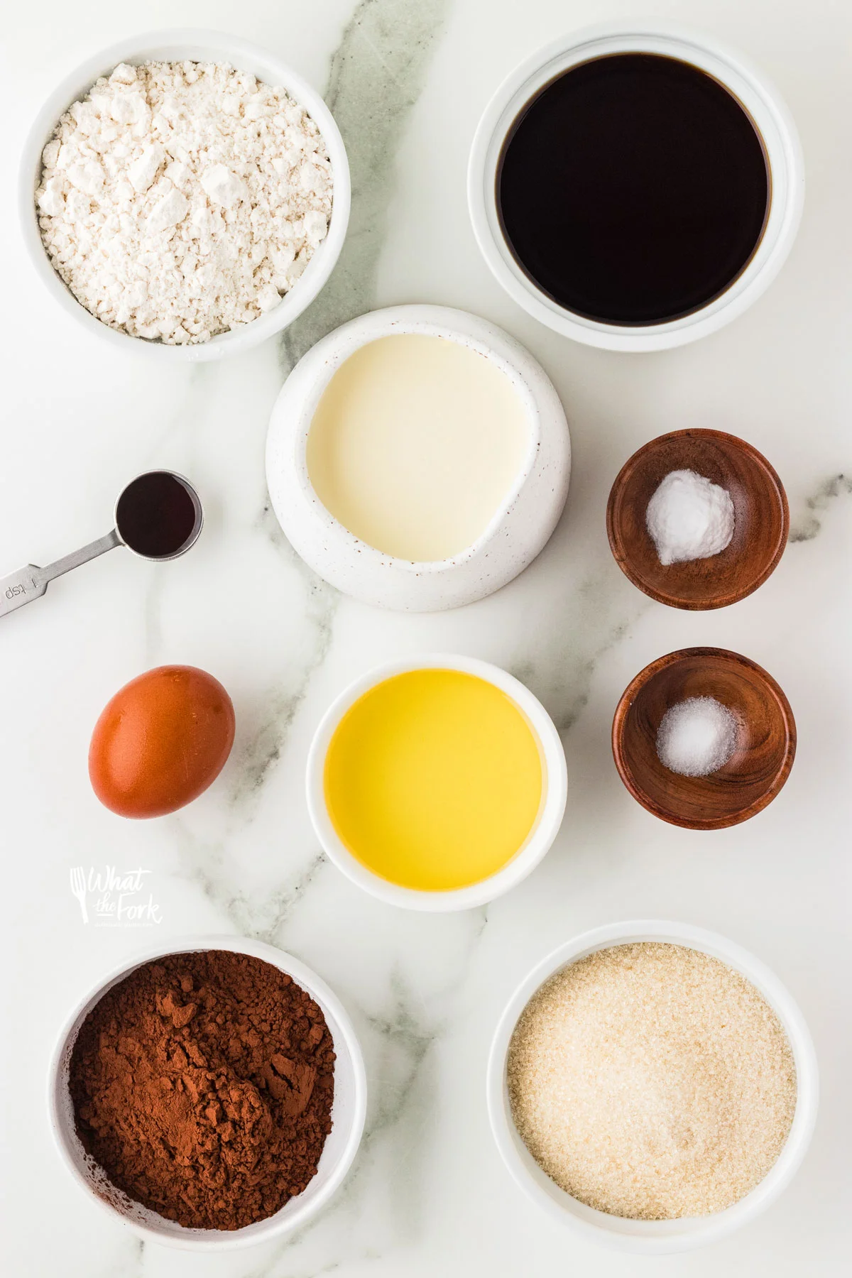 ingredients for gluten free chocolate cupcakes in individual bowls