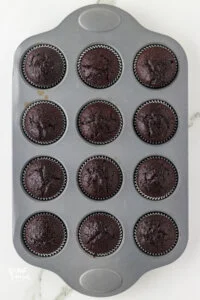 baked gluten free chocolate cupcakes in a silver muffin tin