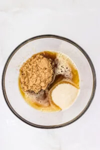 browned butter, brown sugar, and granulated sugar in a glass bowl