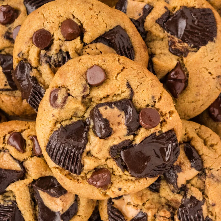 overhead shot of a pile of stacked Loaded Gluten Free Peanut Butter Chocolate Chip Cookies