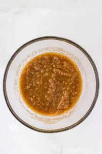 browned butter and sugar whisked together in a glass bowl