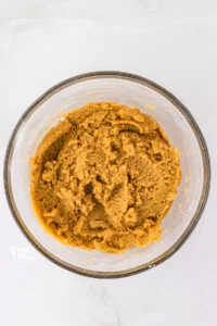 wet and dry ingredients mixed together to make gluten free peanut butter cookies