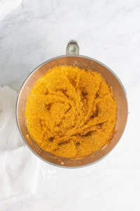creamed butter, sugar, and pumpkin an silver stand mixer bowl