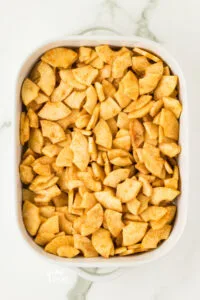 apple filling to make gluten free apple crisp in a white 9x13 baking dish