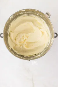 cream cheese beaten in a silver stand mixer bowl