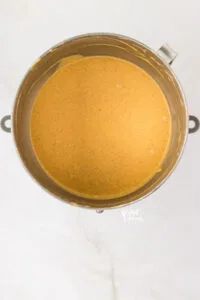 pumpkin cheesecake batter in a silver stand mixer bowl