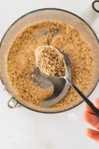 toasted pecans that have been processes with a food processor.