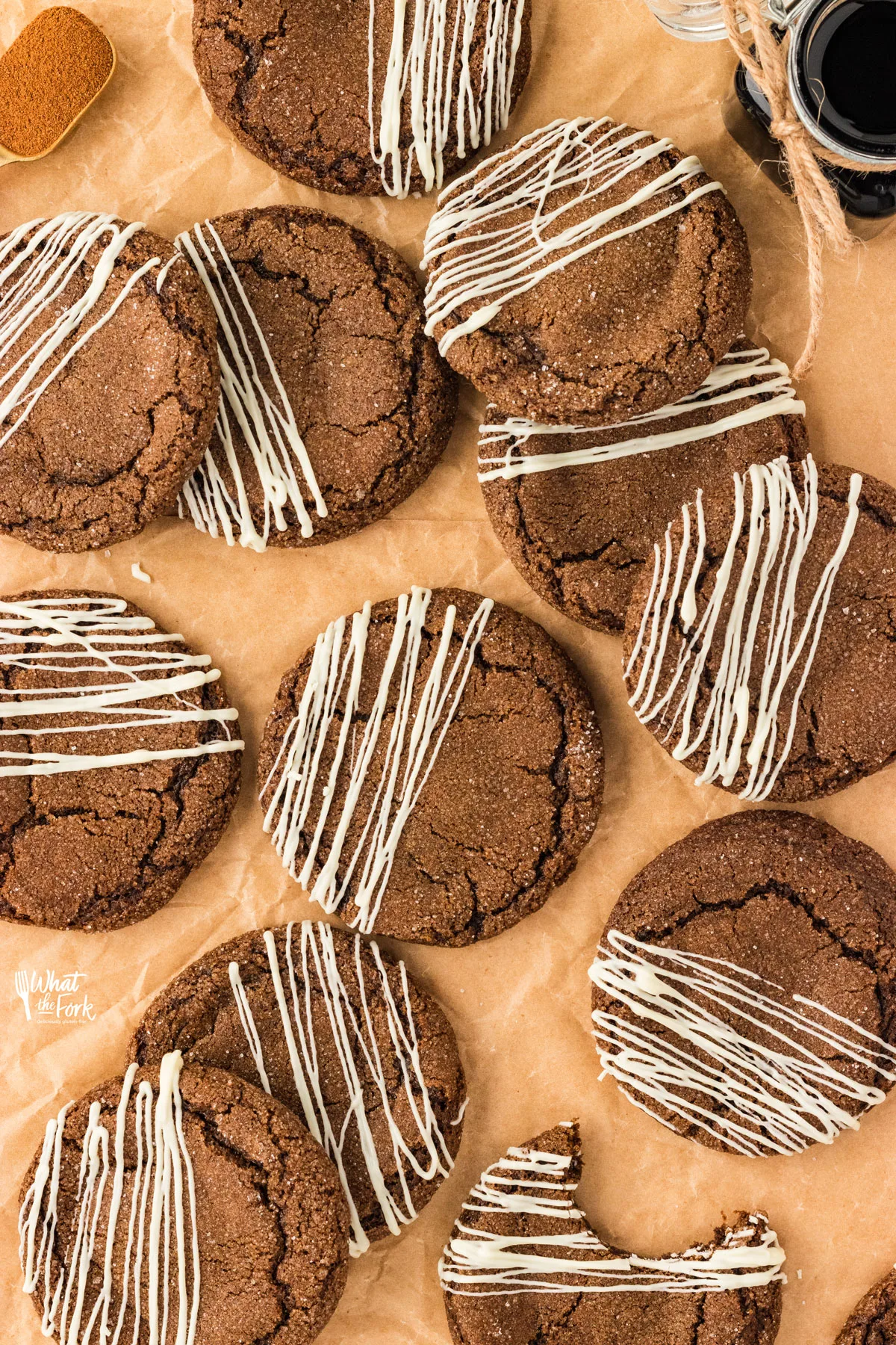 overhead shot of baked gluten free molasses cookies drizzled with white chocolate