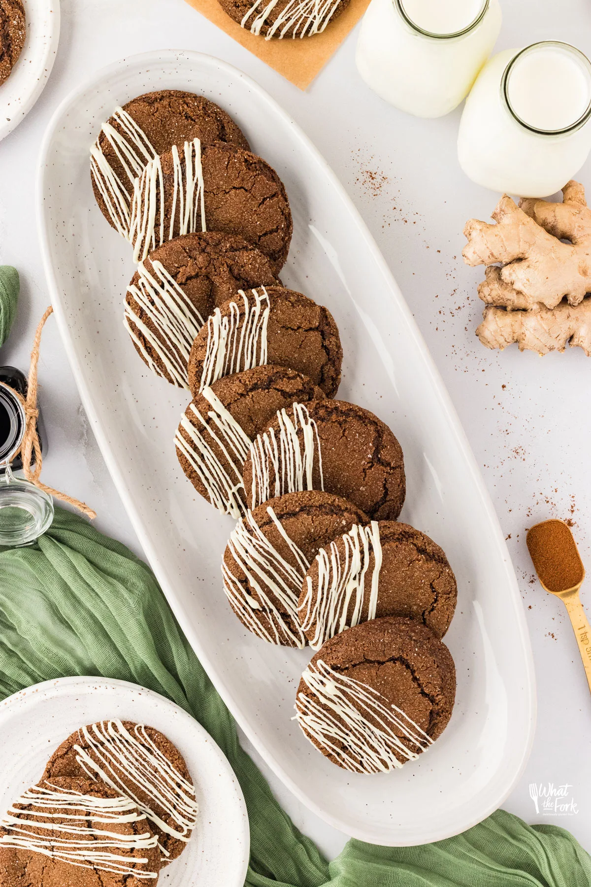 overhead shot of Double Molasses Gluten Free Ginger Cookies (Soft & Chewy) lined up on a long, thin, white serving platter