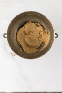 butter and sugar beaten together in a silver stand mixer bowl