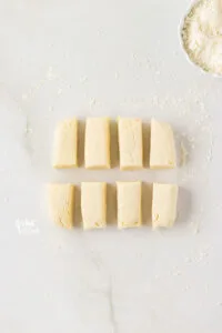 gluten free biscuit dough cut into 8 rectangles
