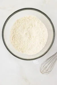 dry ingredients whisked together in a large glass bowl to make gluten free biscuit pretzels
