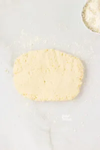 gluten free biscuit dough patted into a rectangle