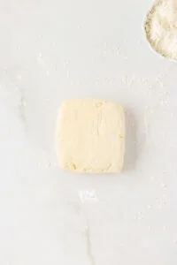 gluten free biscuit dough shaped into a square