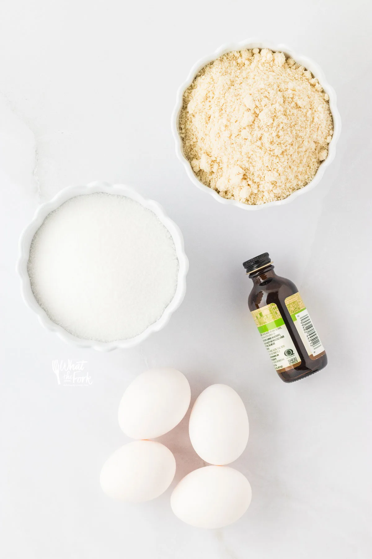 overhead shot of the 4 ingredients needed to make Almond Flour Cake