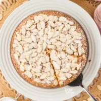 overhead shot of a Gluten Free Almond Flour Cake with a slice cut and being served
