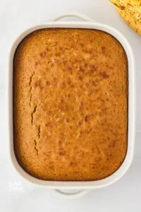 gluten free banana cake baked in a 9x13 white baking pan