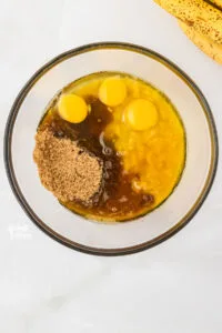 wet ingredients in a clear glass bowl