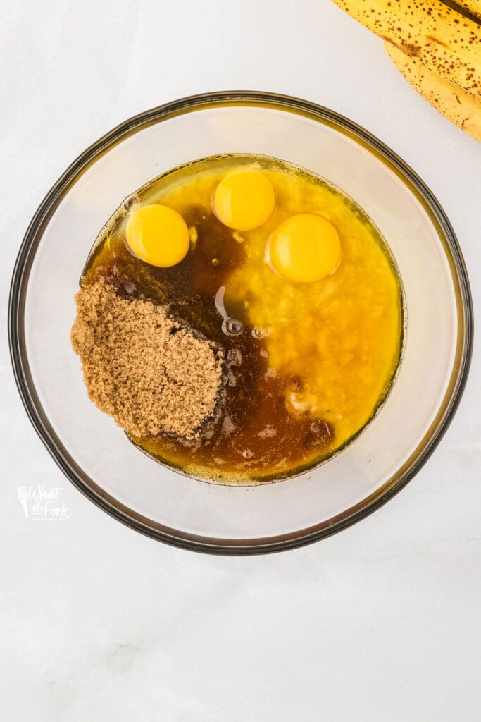 wet ingredients in a clear glass bowl