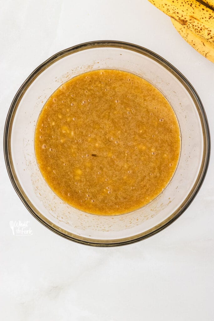 mashed banana in a clear glass bowl