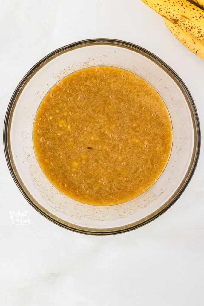 mashed banana in a clear glass bowl